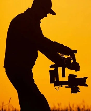 Silhouette of man recording // top video production companies us