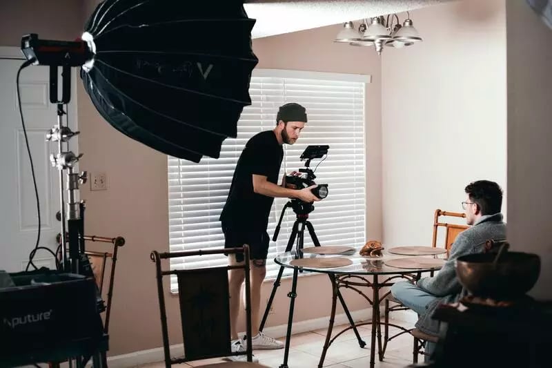 Man being recorded while thinking about budget for corporate video production