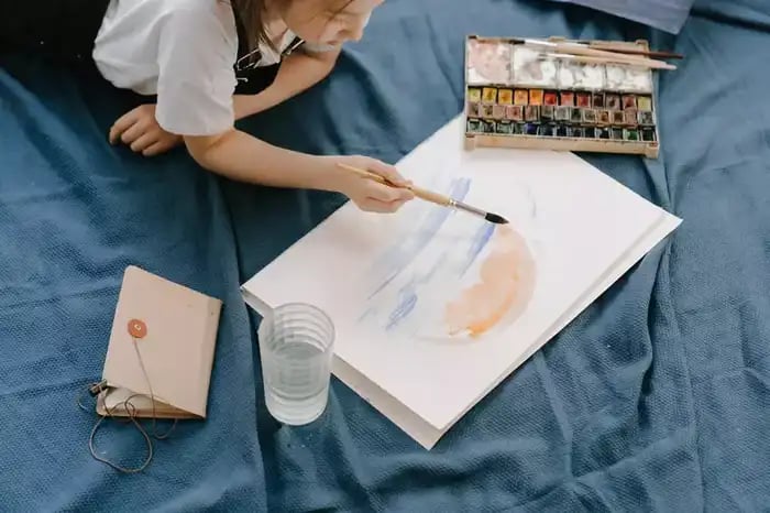 A young girl painting // video production creative process