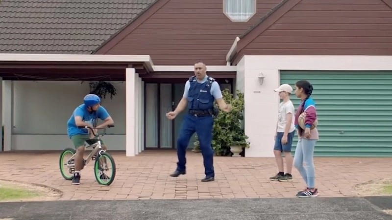 The policeman and the child on a bike