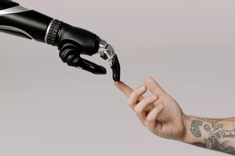 Human hand touching robot hand, used to represent machine learning in video editing