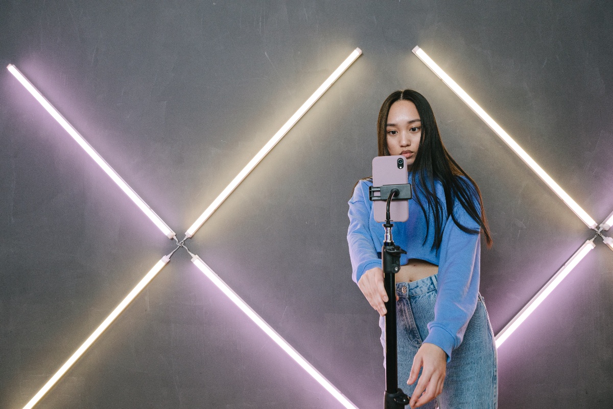 Woman recording a TikTok video